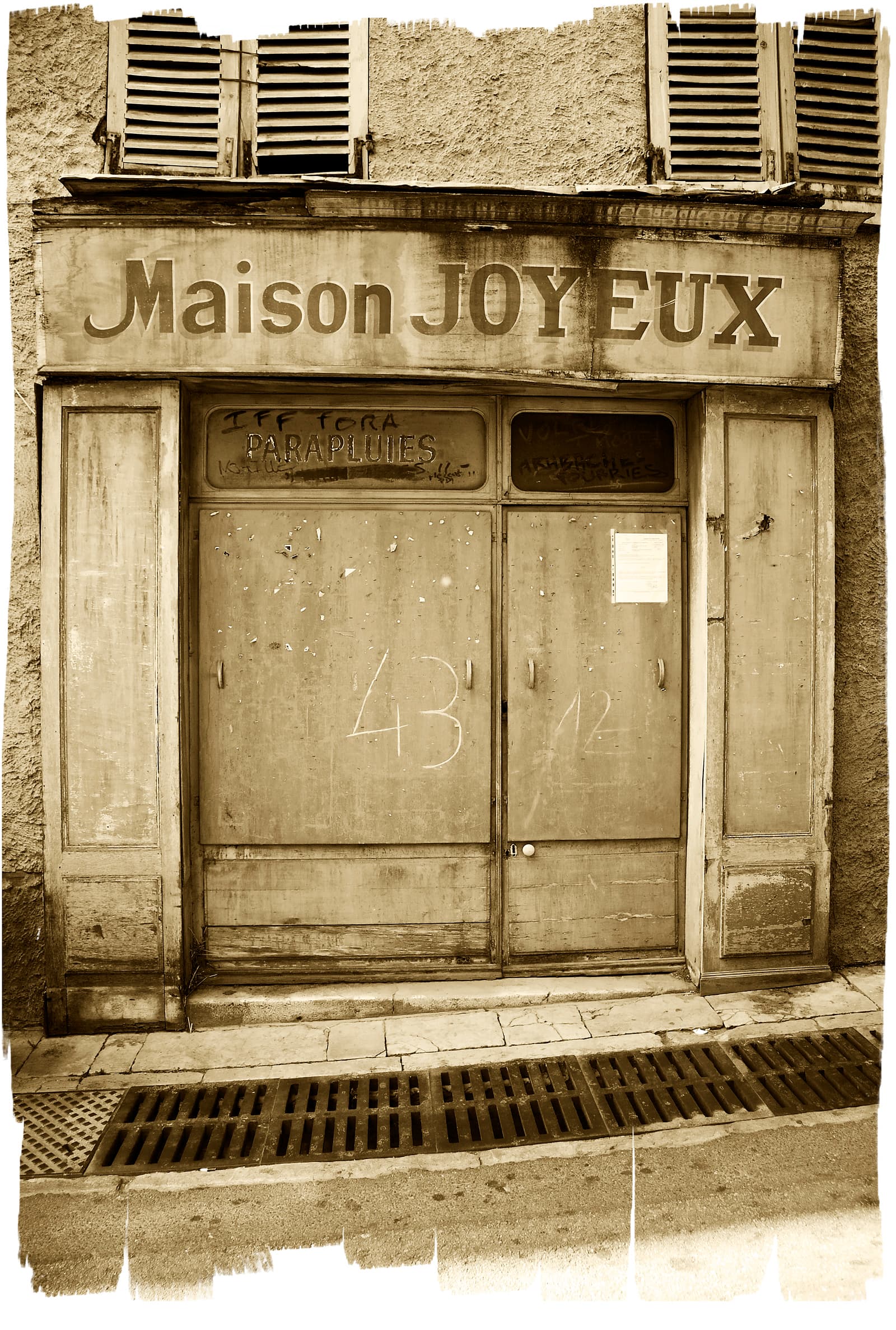 Shuttered shopfront of the former Maison Joyeux, Provence